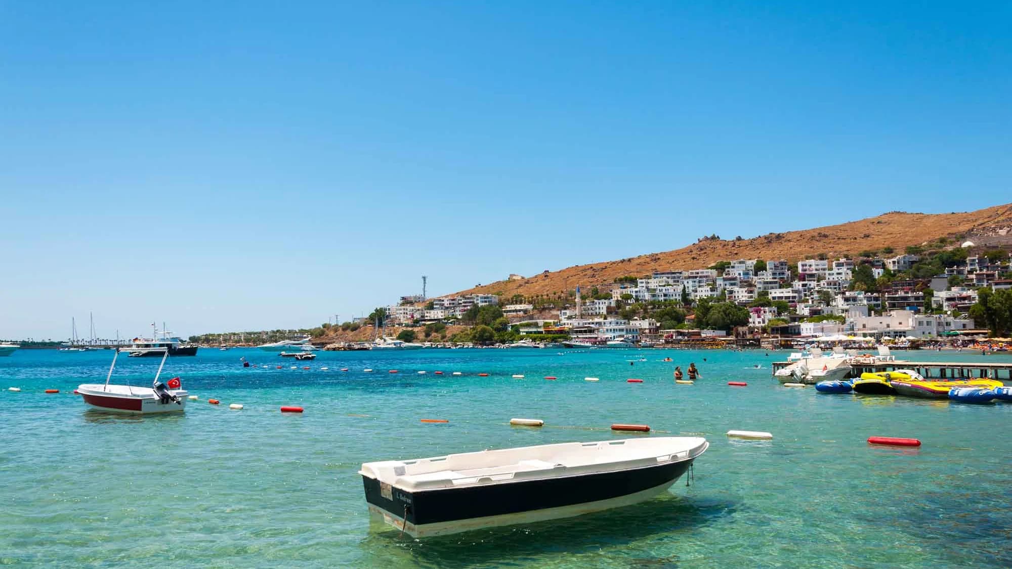 Water-sports area and shoreline across Akyarlar Bay